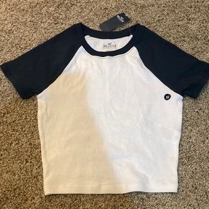 Navy blue sleeves and white body t shirt.